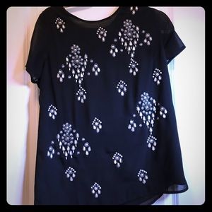 Fancy black blouse with pearl designs.